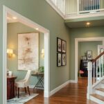 Villa interior painting with soft green walls and wooden flooring.